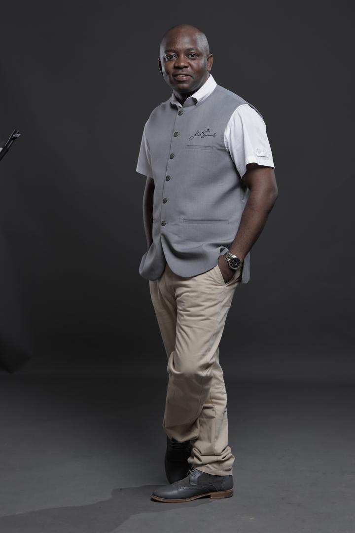 Professional full-length portrait of Joel Siwale